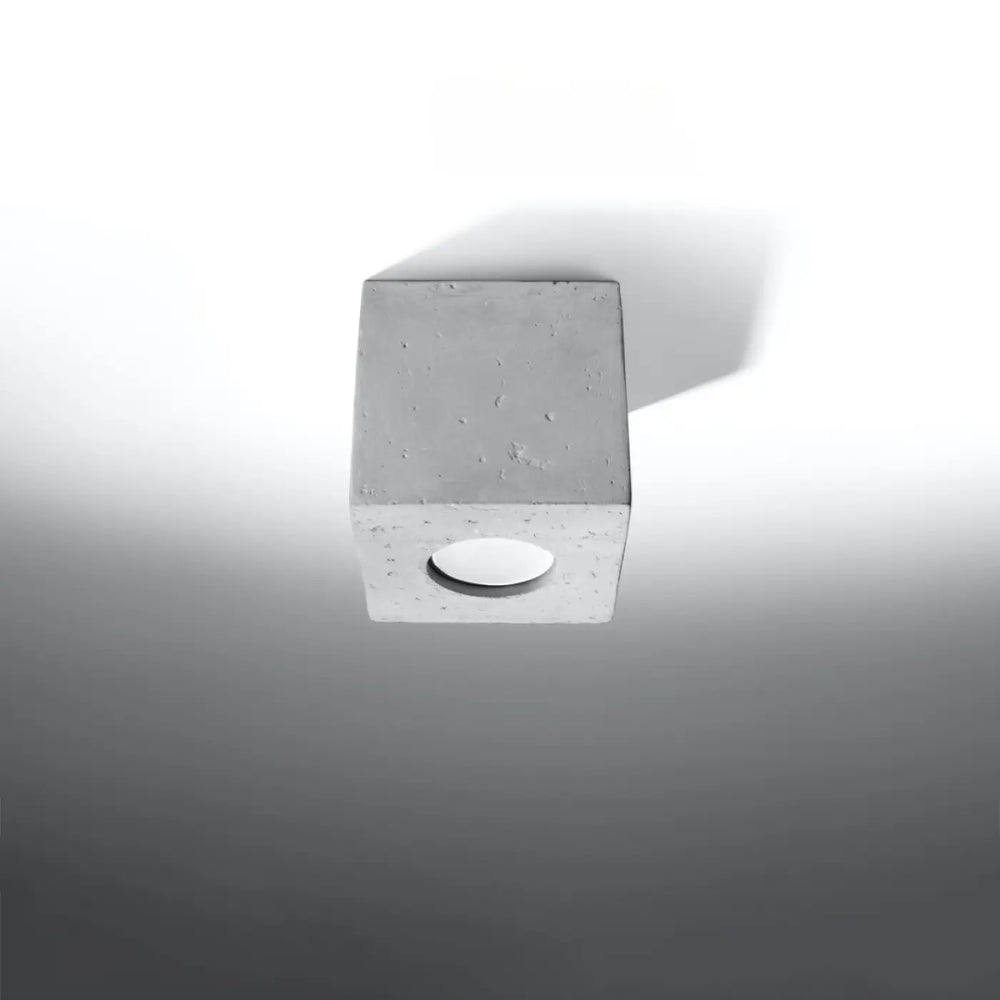 Plafonnier quad beton en forme de cube minimaliste en béton gris avec une découpe circulaire pour éclairage plafond