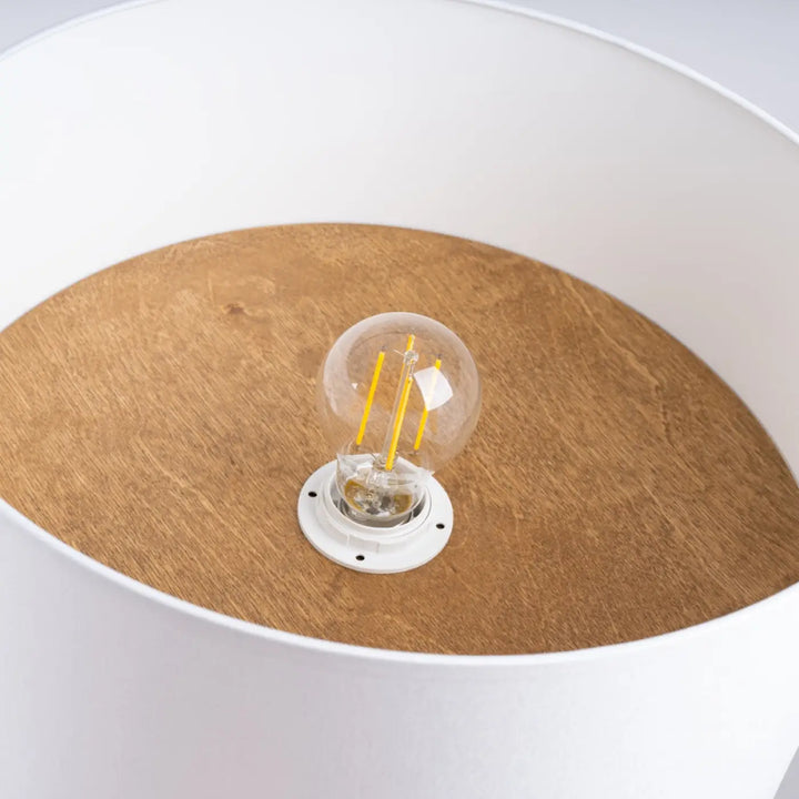 Plafonnier telesto blanc avec ampoule filament clair et base circulaire blanc marron clair design minimaliste parfait