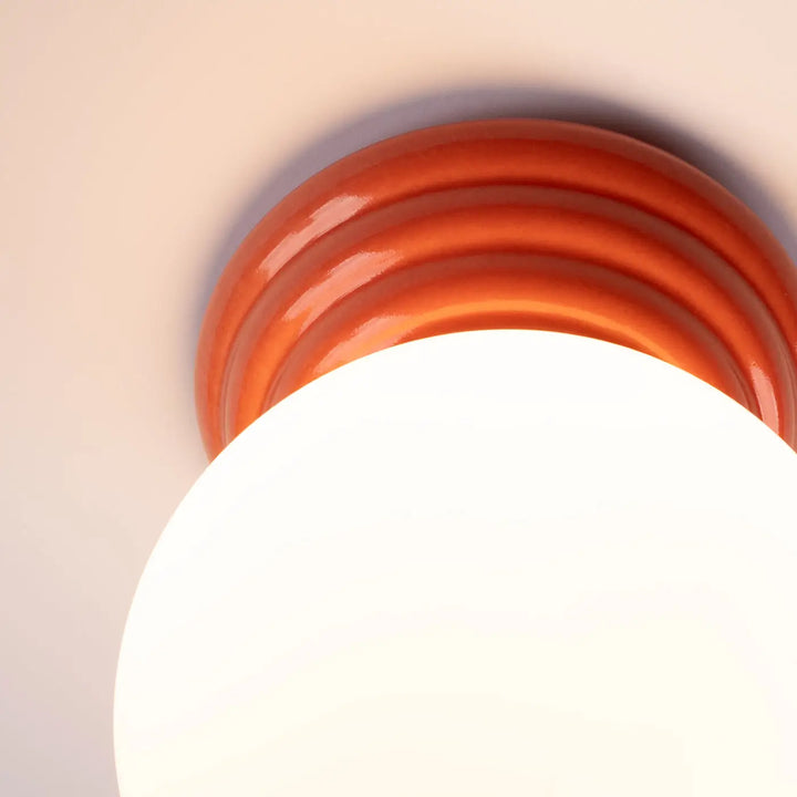 Luminaire plafonnier lampe zori en céramique glossy orange avec ridules concentriques pour une belle décoration aux qualités esthétiques