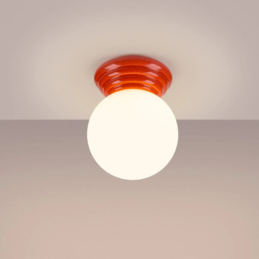 Lampe zori luminaire plafonnier en verre orange vibrant avec ampoule sphérique blanche givrée pour une belle décoration et qualités esthétiques