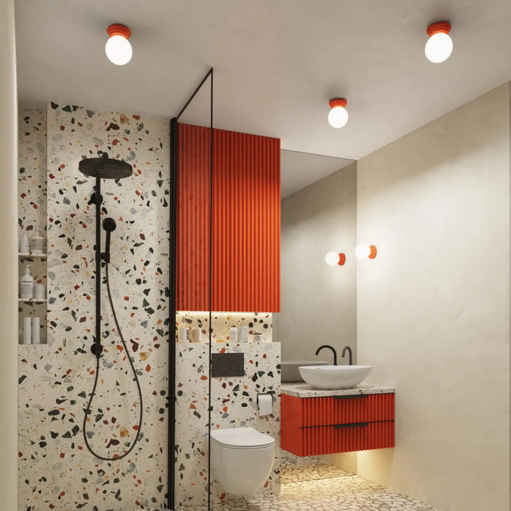Lampe zori plafonnier orange nervuré avec poignées noires et éclairage indirect pour une belle décoration et qualités esthétiques