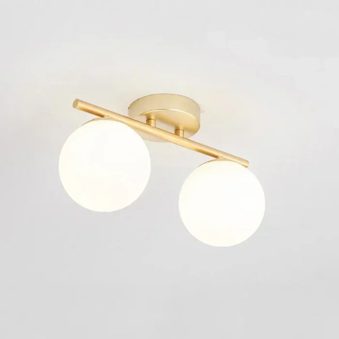 Luminaire plafonnier moderne en boules blanches avec support doré