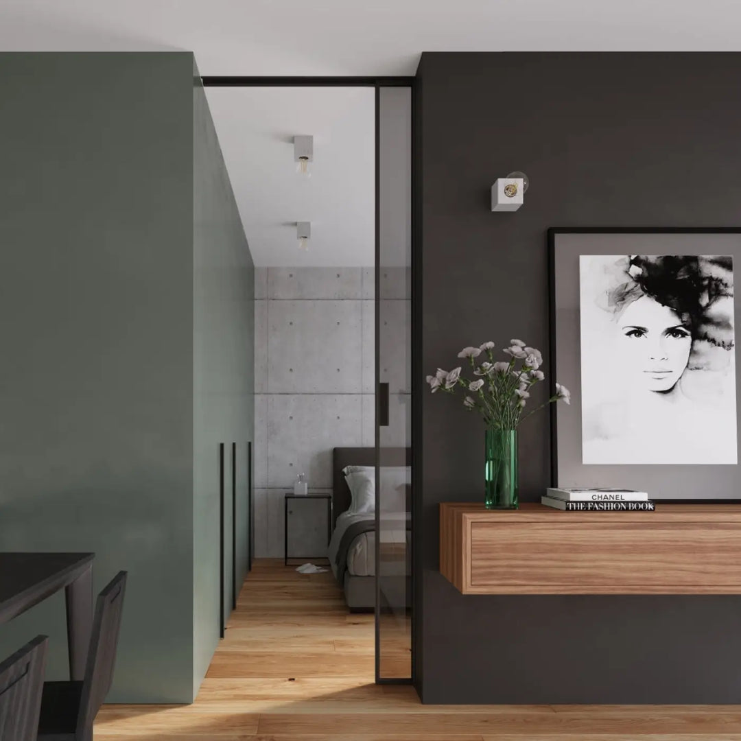 Plafonnier ariz en béton avec un vase en verre vert contenant des fleurs blanches pour un style loft