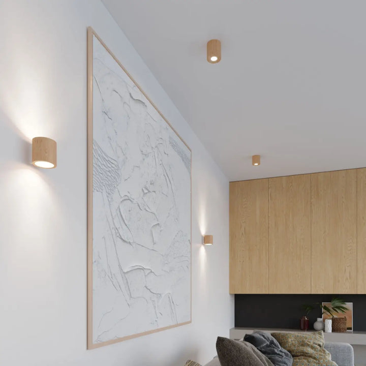 Luminaire plafonnier orbis en bois naturel avec appliques murales cylindriques minimalistes montées individuellement pour une ambiance chaleureuse