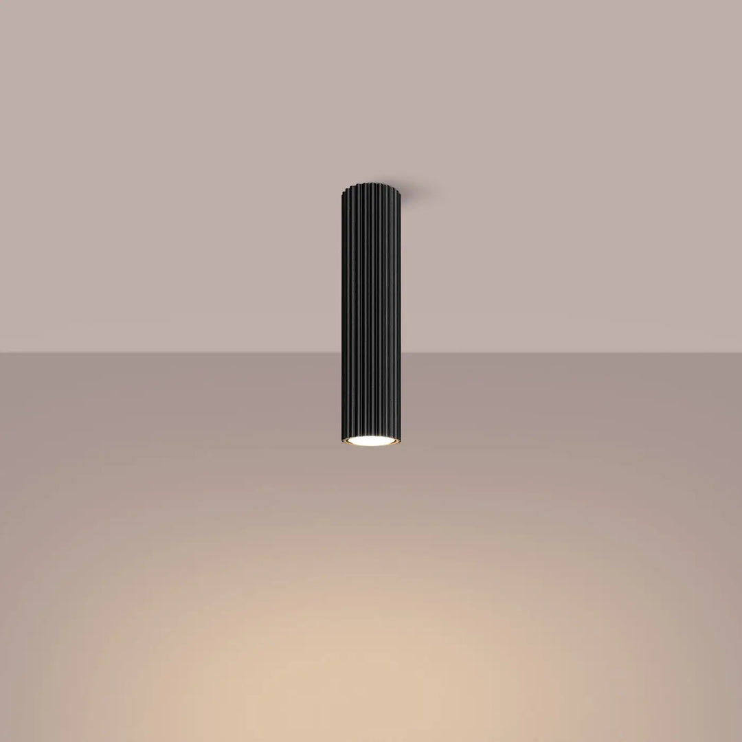 Plafonnier karbon allie noir cylindrique avec rainures verticales et base illuminée lumière chaude ampoules gu10 interchangeables design minimaliste