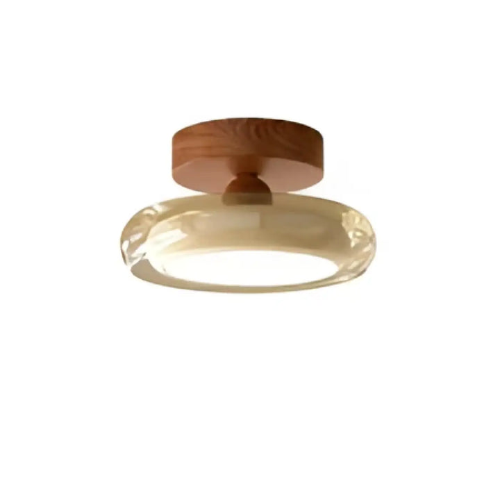 Luminaire plafonnier auriona avec base circulaire en bois chaud et anneau en verre soufflé diffusant une lumière douce