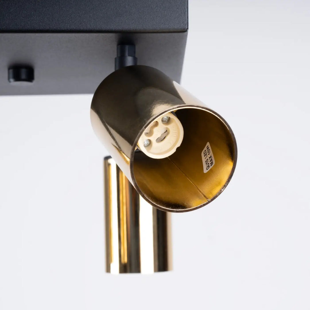Luminaire plafonnier winx 4 avec spot cylindrique finition dorée et base noire mate design moderne allie
