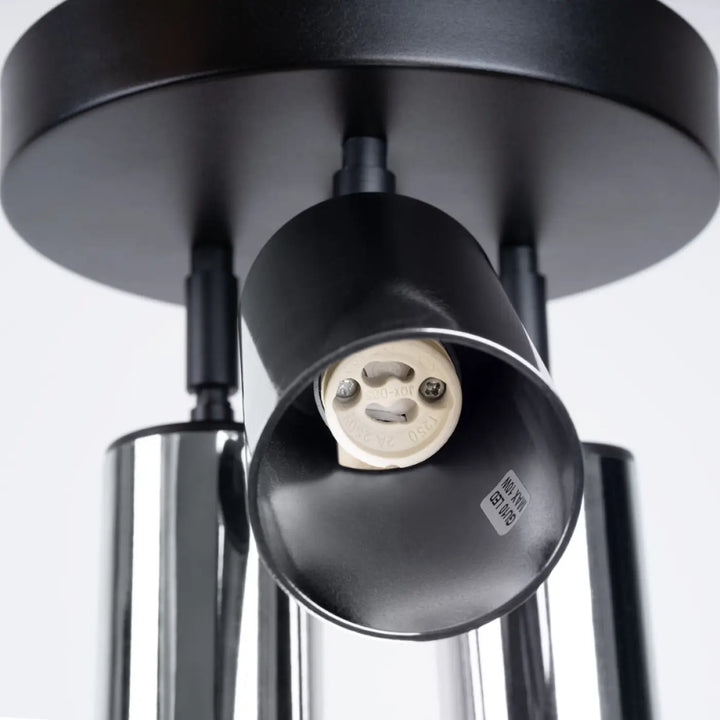 Plafonnier winx 3p noir avec finition mate noire, abat-jours cylindriques et accents chrome design moderne