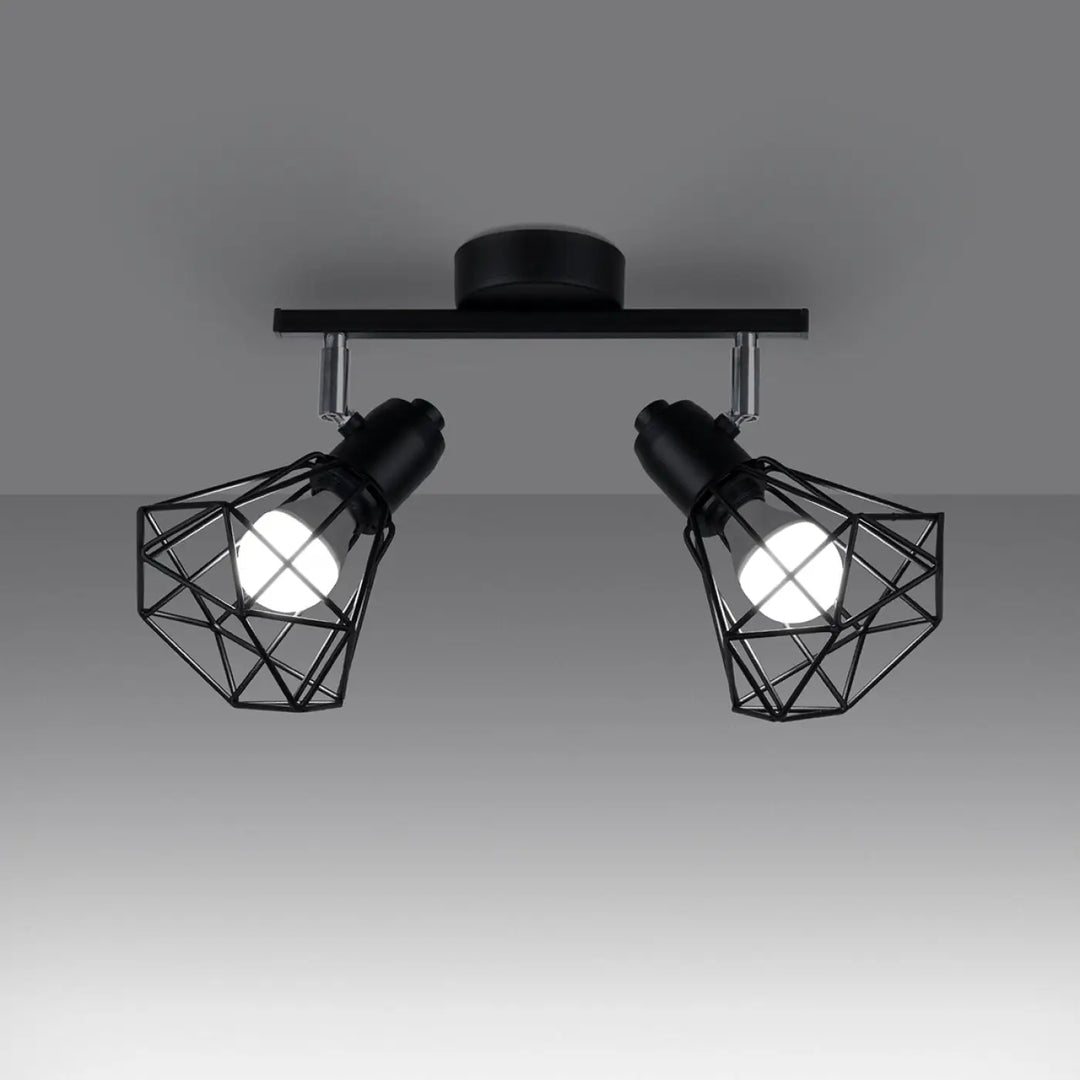 Luminaire plafonnier série artemis noir avec deux spots réglables créant une atmosphère intime moderne