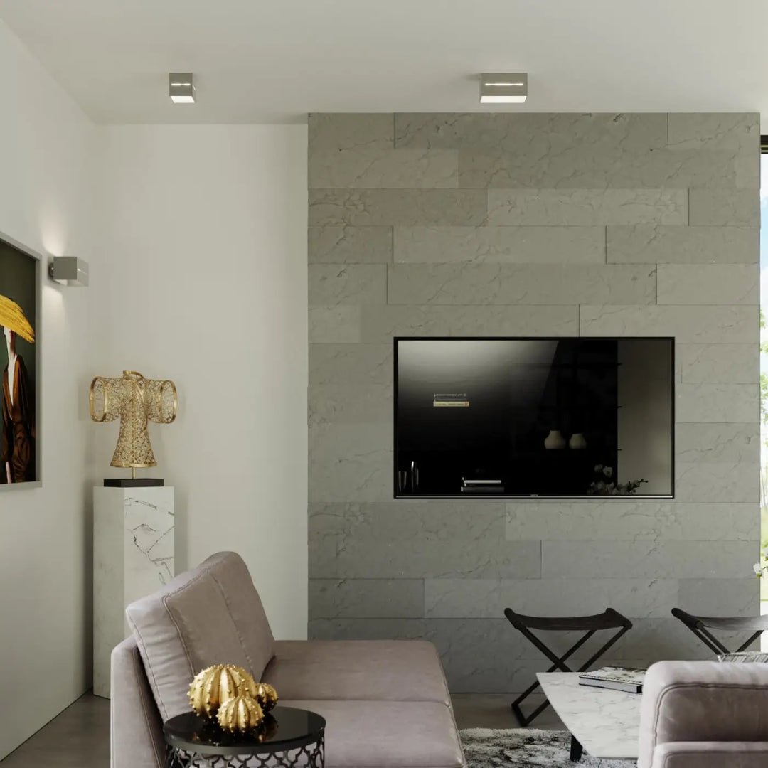 Luminaire plafonnier lobo gris monté sur mur en marbre avec télévision écran plat noir pour spectacle lumineux perforation linéaire