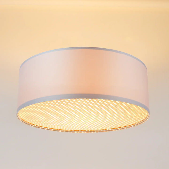 Luminaire plafonnier gris perle cylindre rose doux avec bordure gris glossy et base en maille alvéolée illuminée