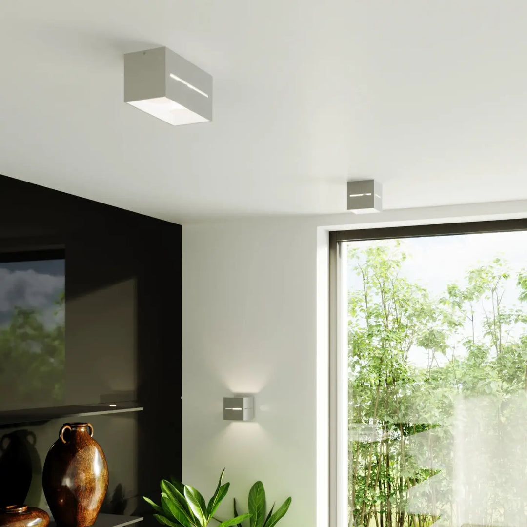 Plafonnier lobo 2 gris moderne minimaliste avec perforation linéaire et spectacle lumineux led intégré