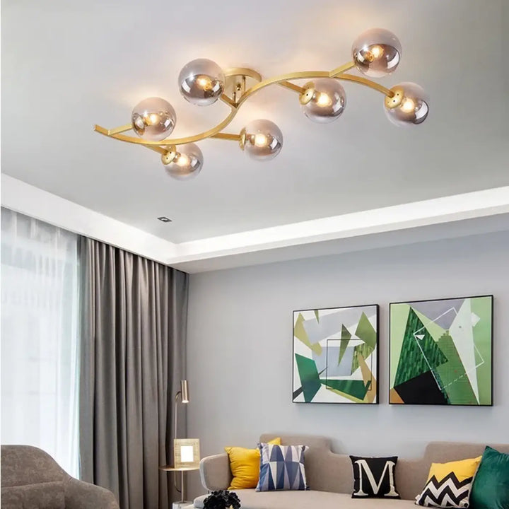 Luminaire plafonnier métal doré avec boules en verre moderne