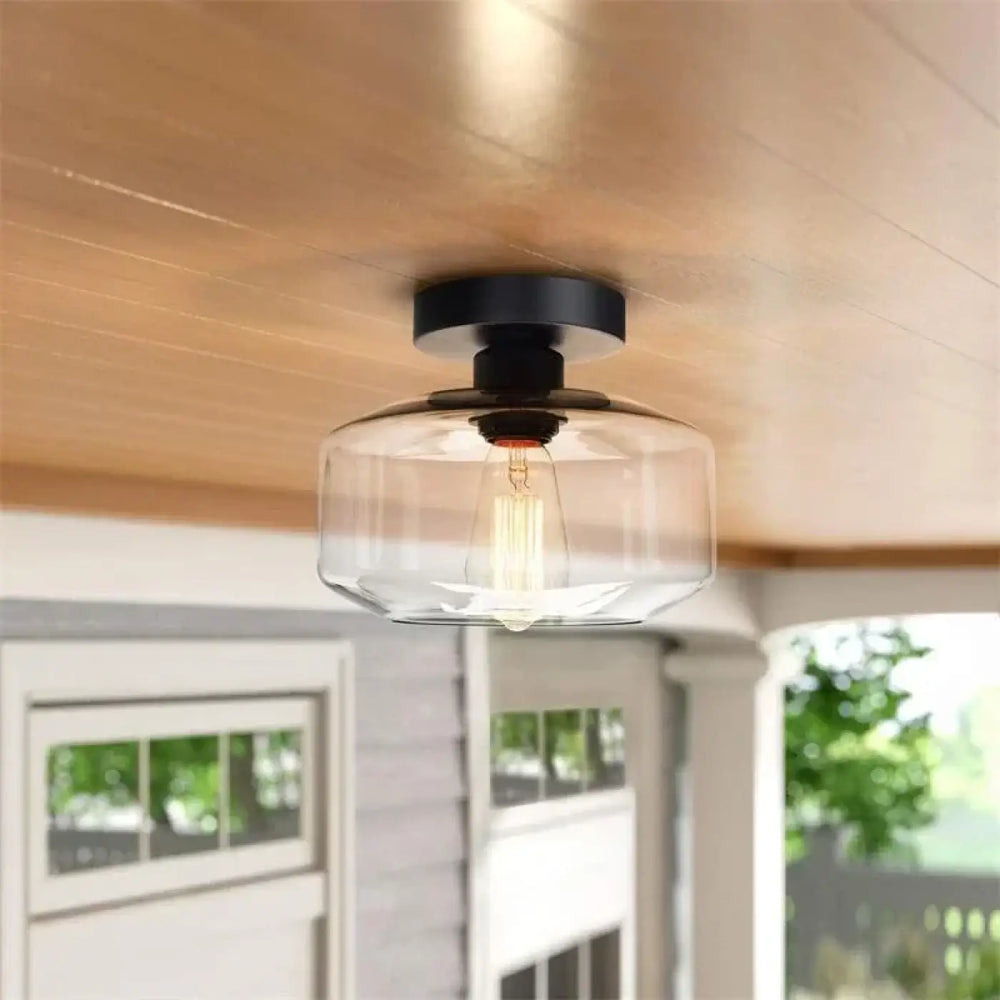 Luminaire plafonnier alto en verre moderne avec base métal noire et ampoule filament exposée