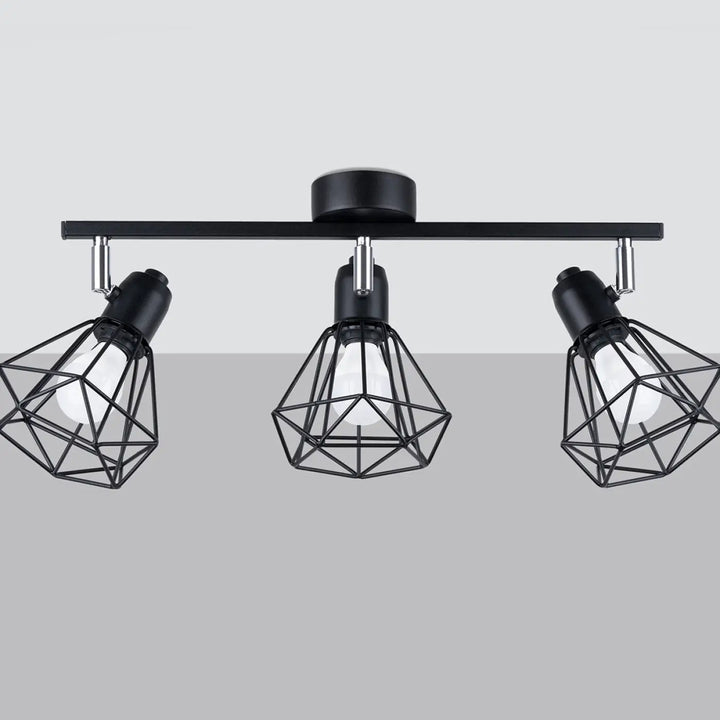 Luminaire plafonnier série artemis 3 noir avec trois cages géométriques réglables créera une atmosphère intime