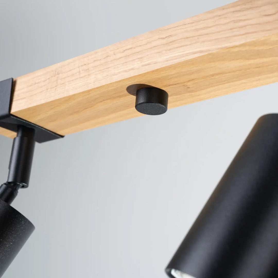 Lampe directionnelle fager 4l noir avec abat-jours orientables en boîtier moderne fixé sur poutre en bois