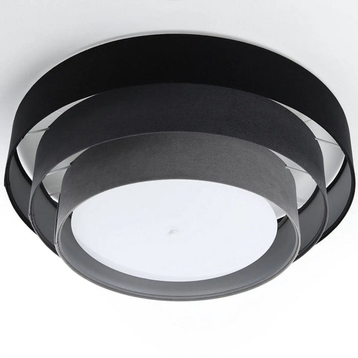 Luminaire plafonnier noir gris avec abat-jour en tissu superposé et diffuseur central blanc moderne