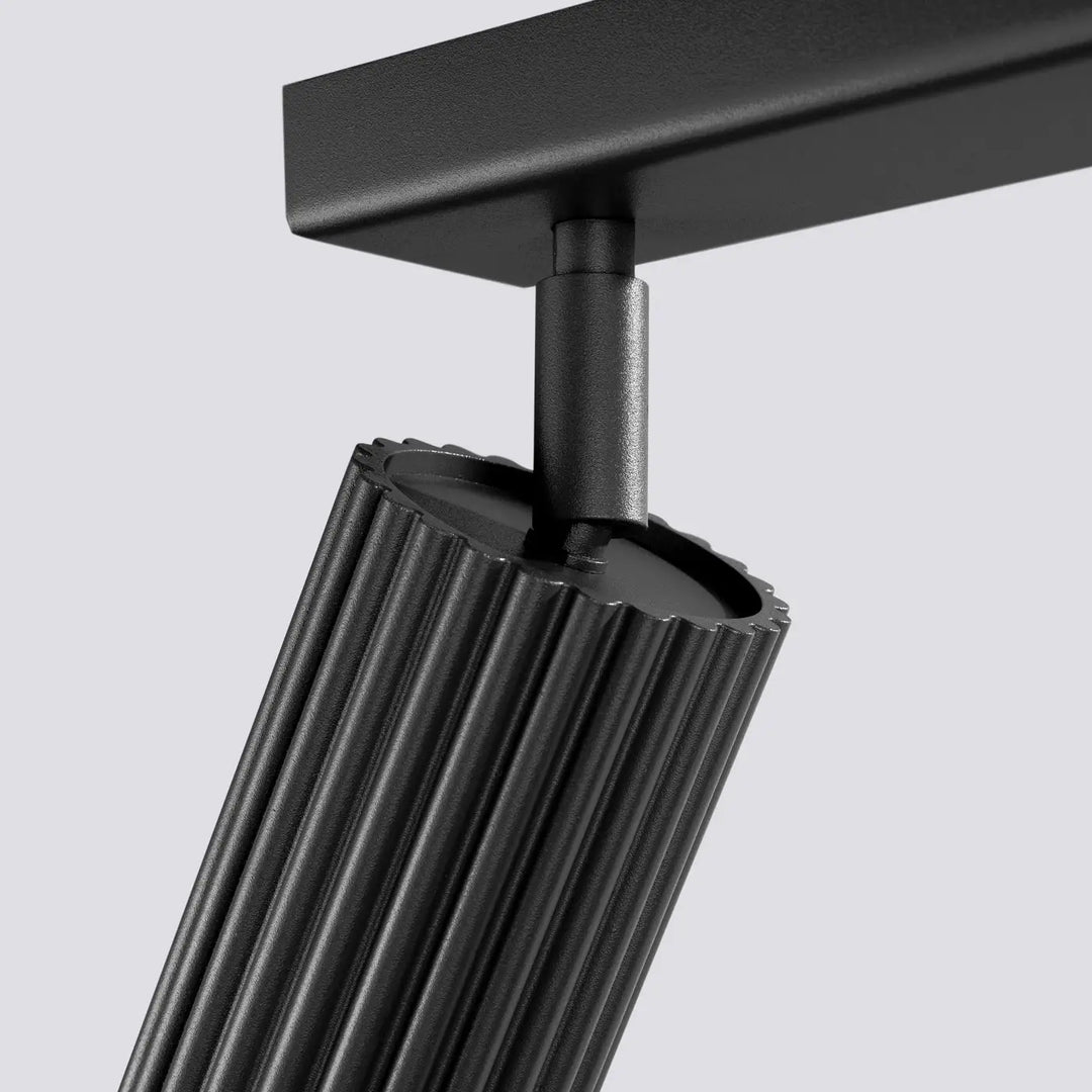 Plafonnier karbon allie design minimaliste et ampoules gu10 interchangeables avec finition mate noire et corps cylindrique cannelé