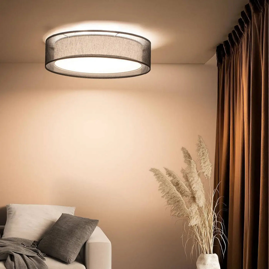 Luminaire plafonnier noir circulaire avec abat-jour en tissu texturé gris foncé et cadre métallique élégant pu ro