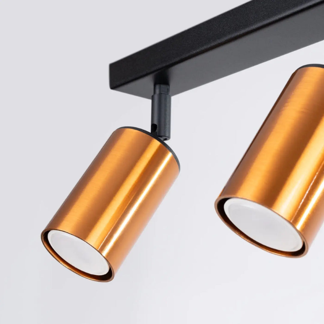 Plafonnier winx 3 avec lampes cylindriques cuivre sur barre de fixation noire design winx allie élégant