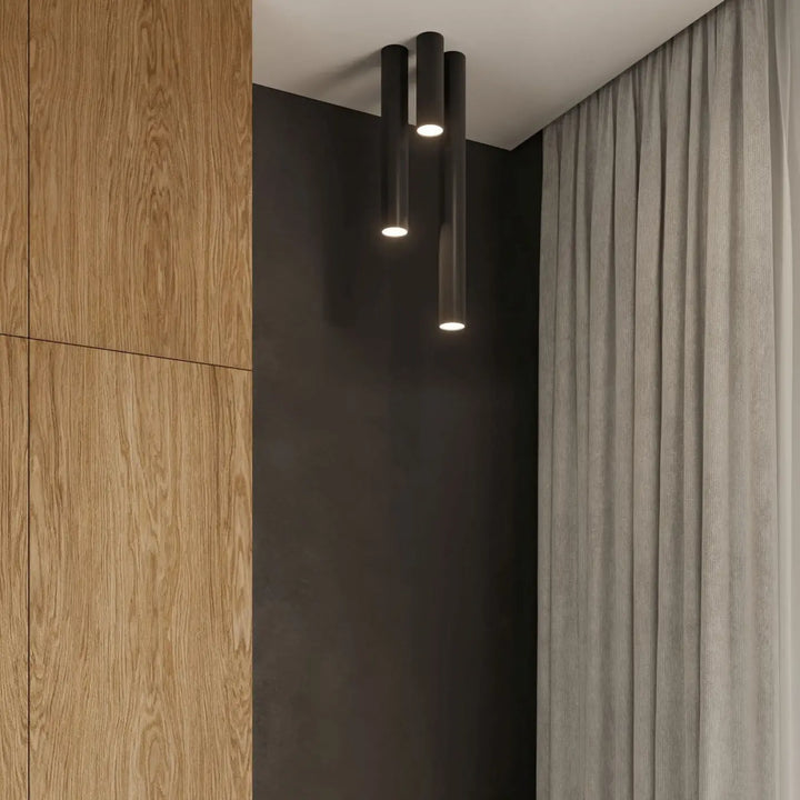 Luminaire plafonnier lagos 60 noir avec trois cylindres élégance moderne et lumière fonctionnelle chaleureuse