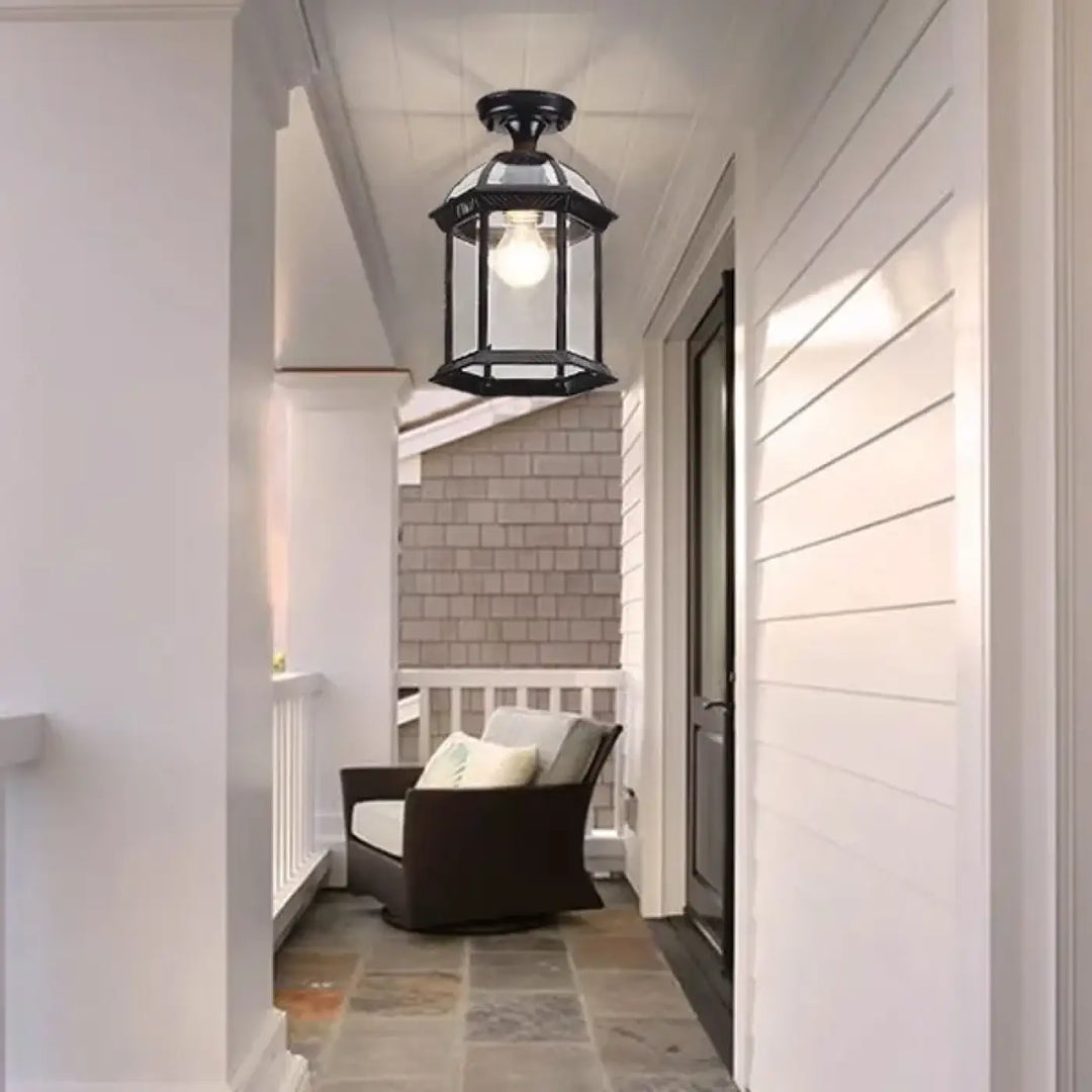 Luminaire plafonnier kaguya en métal noir avec lanterne en fer forgé et ampoule exposée pour style vintage