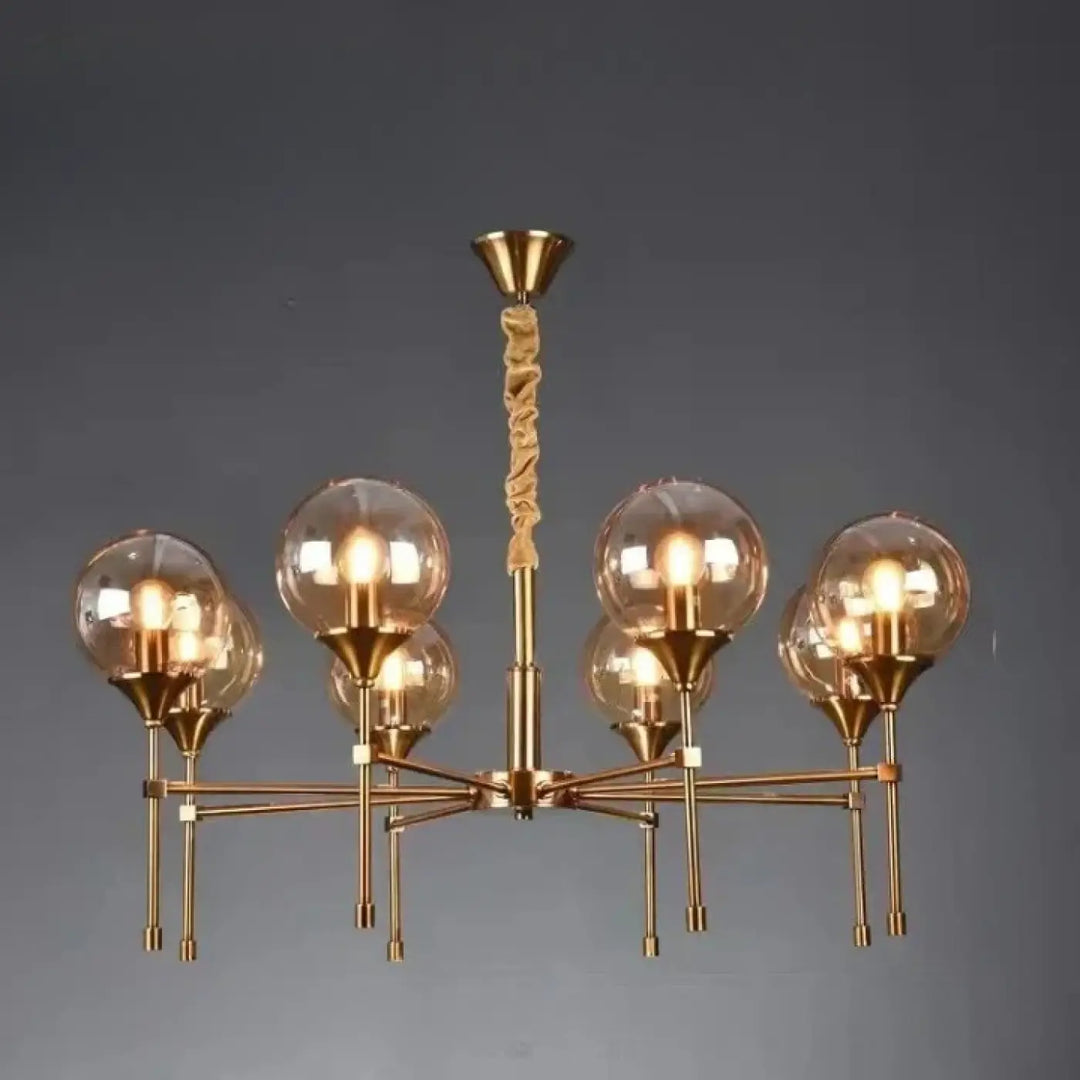 Suspension luminaire bublor dorée avec six globes en verre sphériques et câble torsadé évitant frais supplémentaires