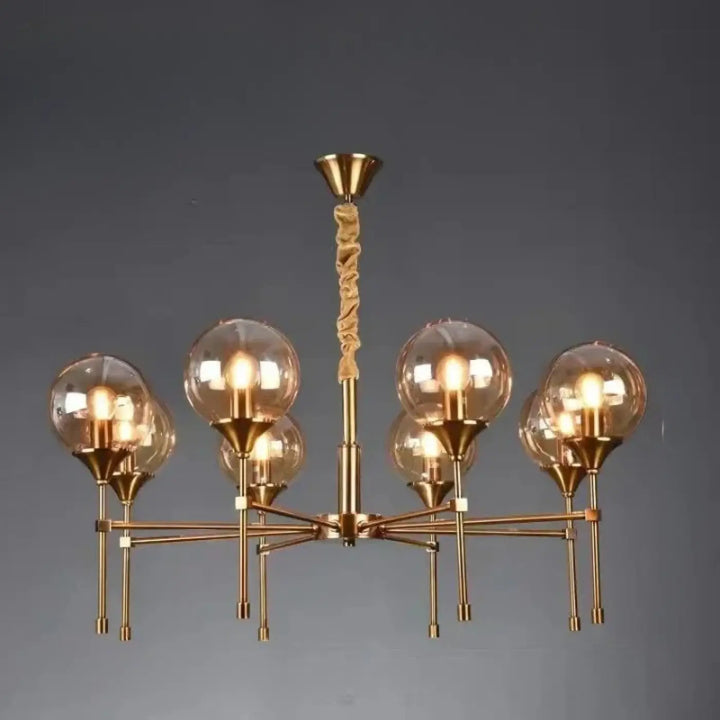 Suspension luminaire bublor dorée avec six globes en verre sphériques et câble torsadé évitant frais supplémentaires