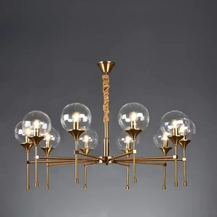 Suspension luminaire bublor or ton avec tige centrale torsadée et abat-jour globe en verre clair sans frais supplémentaires