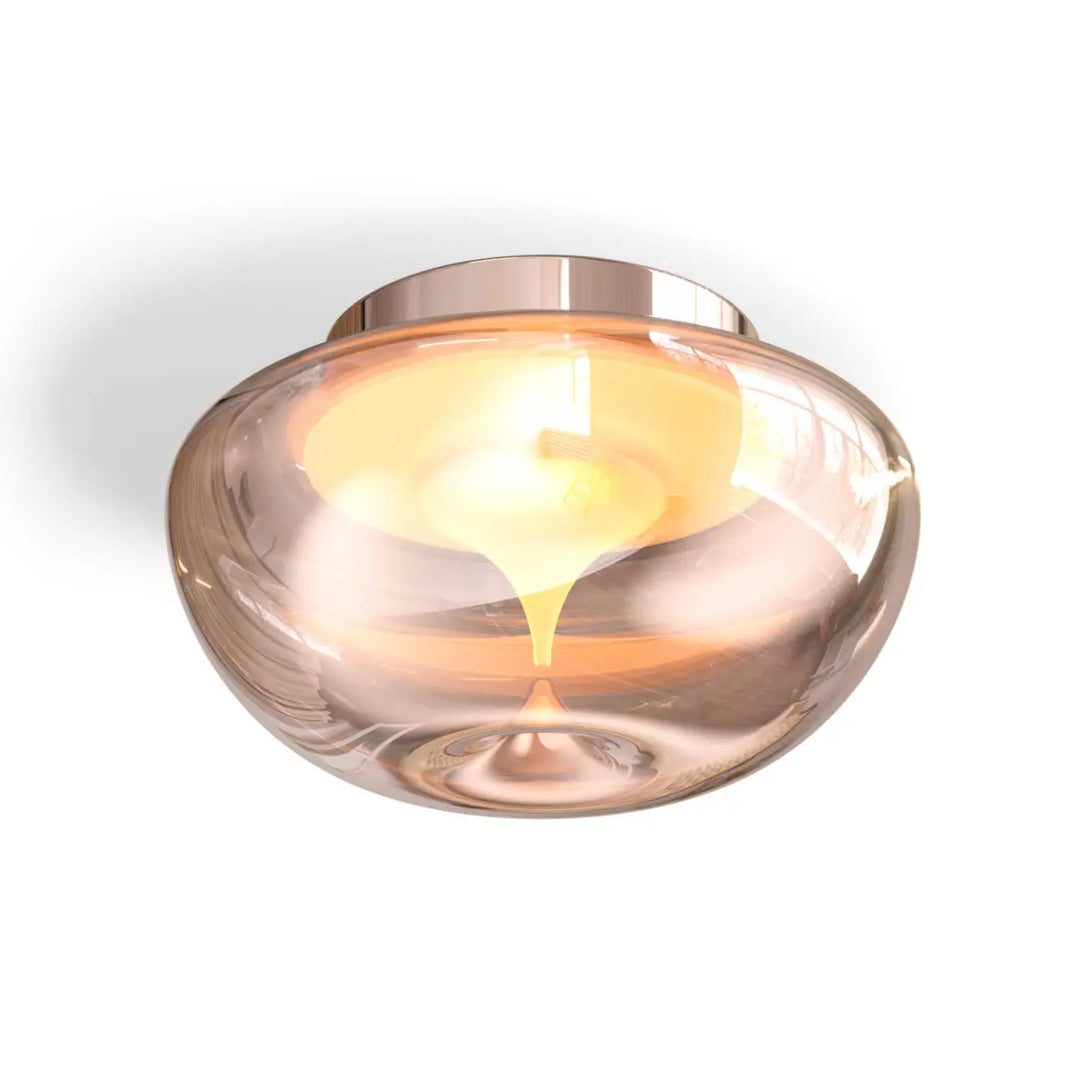 Luminaire plafonnier bond double disque en finition rose gold avec dôme en verre sablé ambre diffusant une lumière chaude