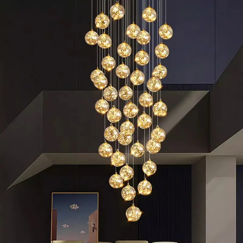 Plafonnier cascade moderne à LED dorées suspendues

