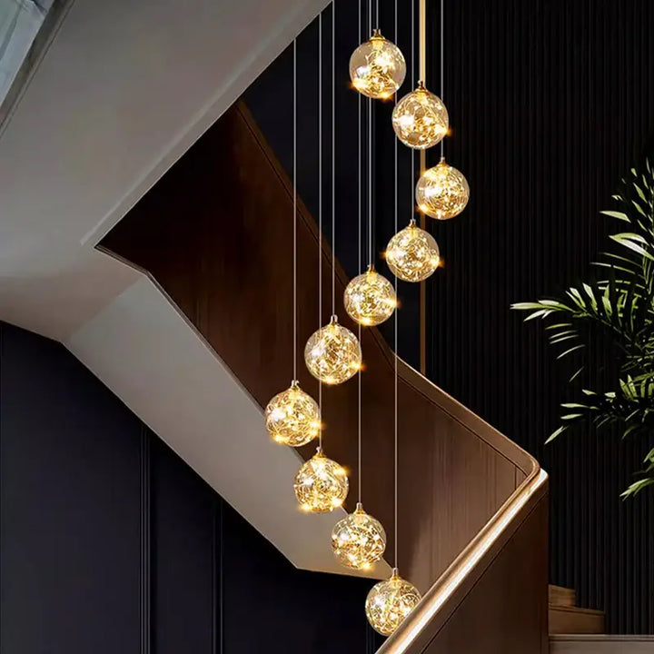 Plafonnier cascade moderne à LED dorées suspendues

