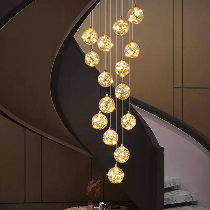 Plafonnier cascade moderne à LED dorées suspendues

