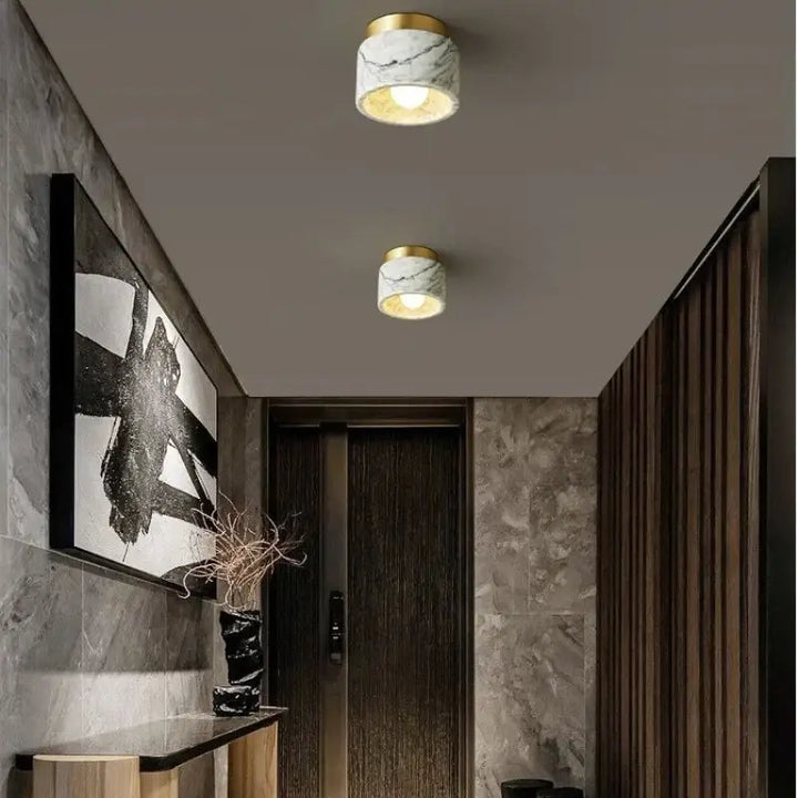 Plafonnier cylindre marbre élégant ambiance luxe blanc