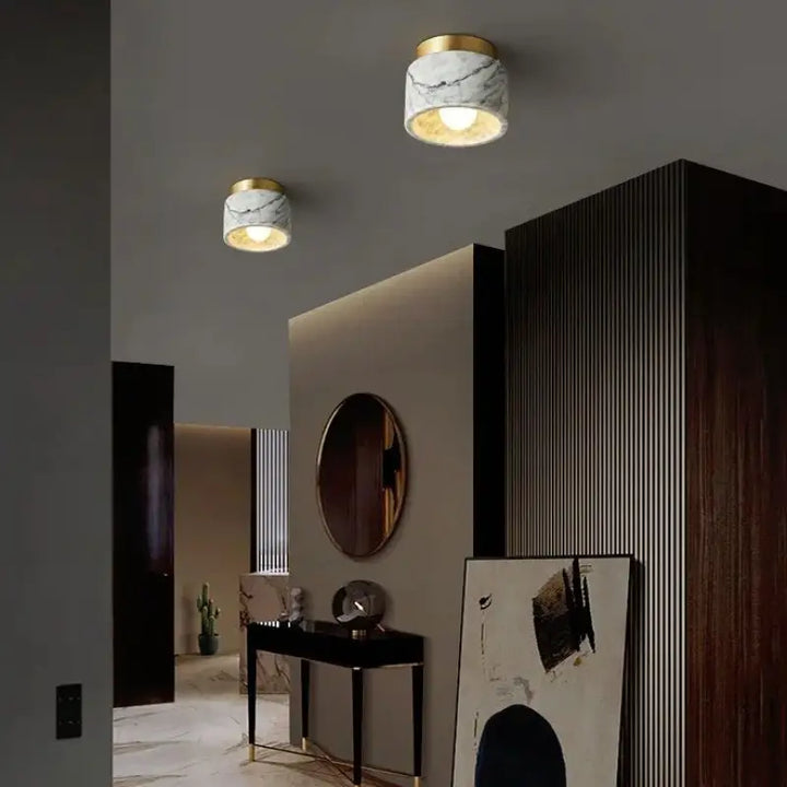 Plafonnier cylindre marbre élégant ambiance luxe blanc