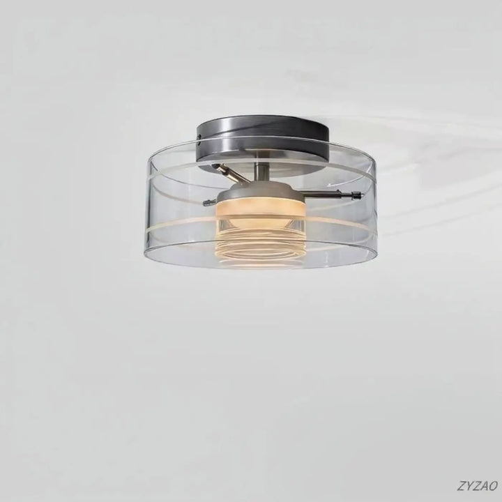Luminaire plafonnier albeo avec abat-jour cylindrique en verre clair et quincaillerie en métal brossé moderne