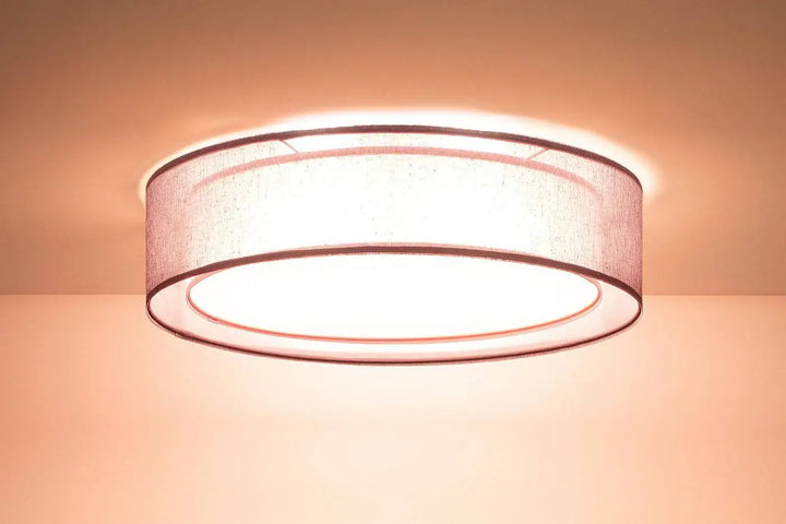 Plafonnier violet design rond avec abat-jour en tissu beige texturé diffusant une lumière douce et uniforme