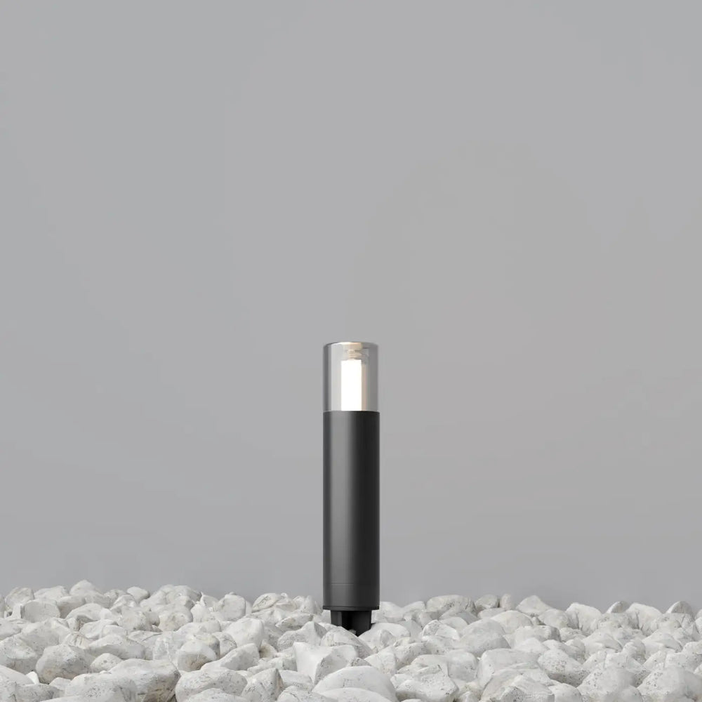Potelet extérieur en acier noir cylindre fin glide avec lumière blanche douce et verre transparent