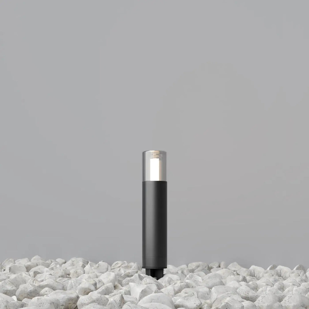 Potelet extérieur en acier noir cylindre fin glide avec lumière blanche douce et verre transparent
