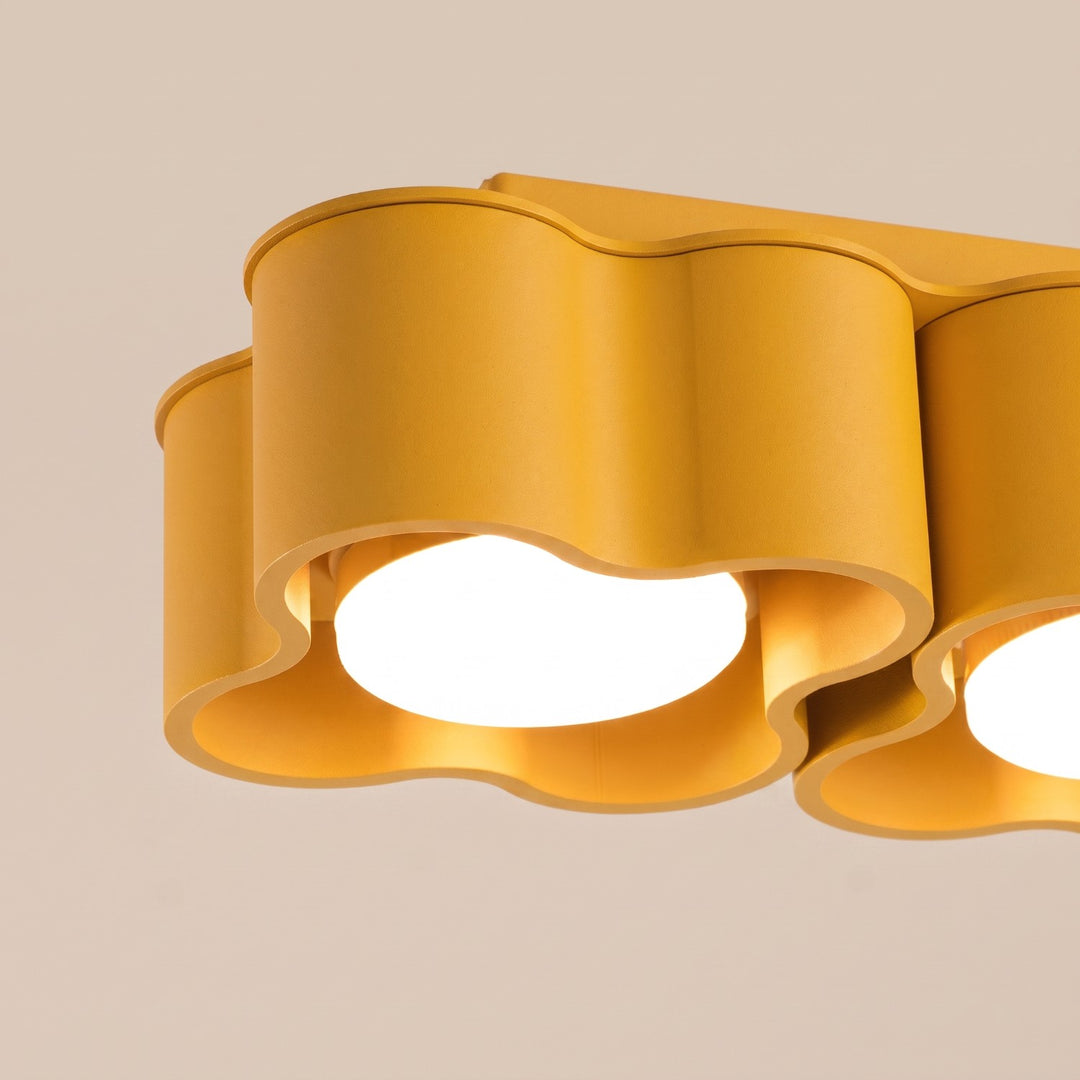 Plafonnier Ovio jaune en aluminium, détail du contour ondulé