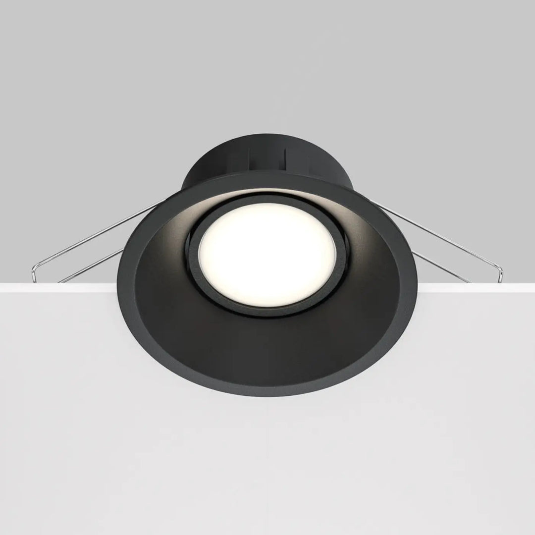 Spot encastrable dot rond en finition mate noire avec design circulaire et fils de montage visibles au dos