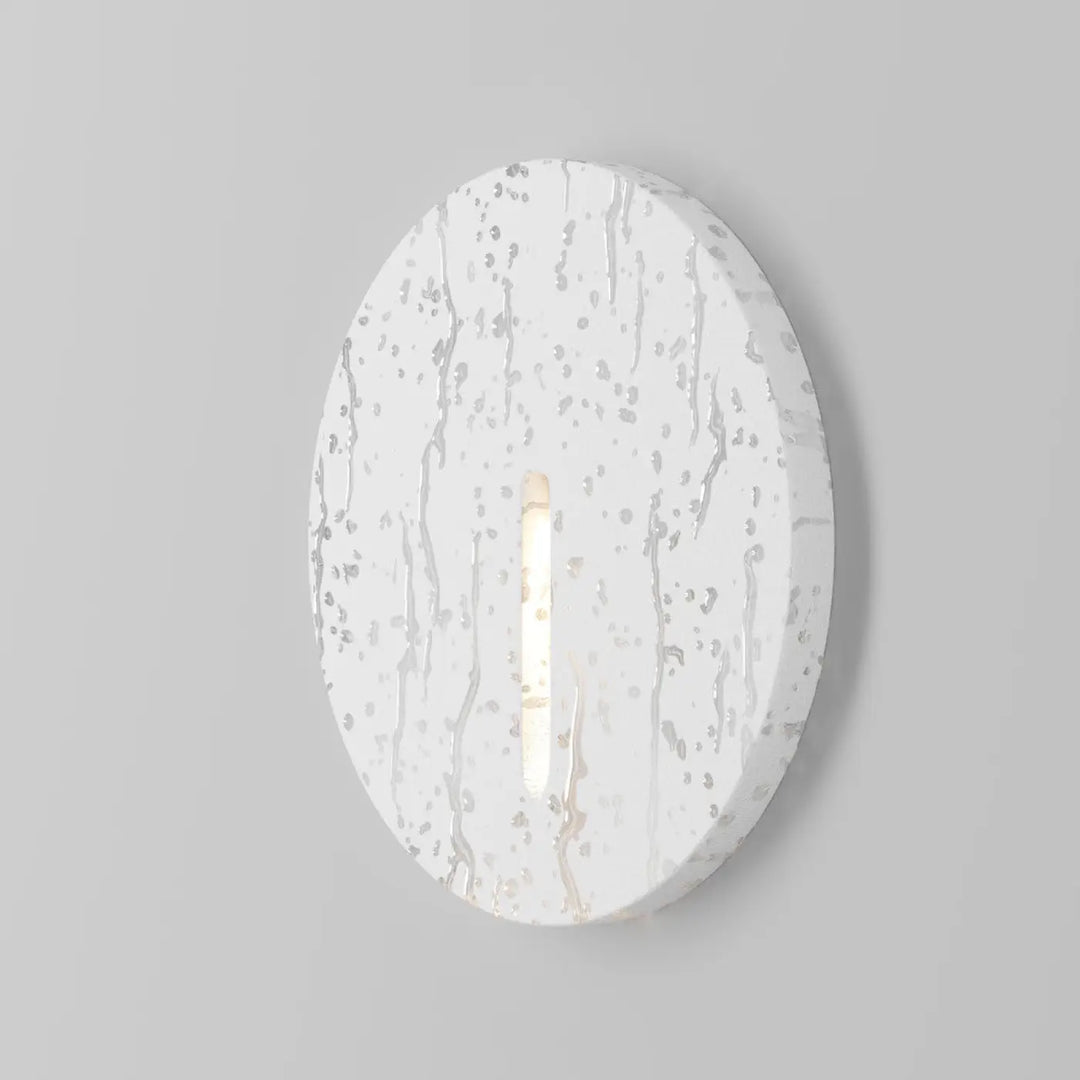Balise ronde luminaire extérieur blanc ovale avec spot encastrable lock led central à surface texturée et tachetée
