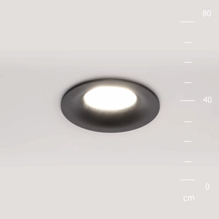 Spot encastré rond discret avec finition noire mate et éclairage général blanc doux circulaire