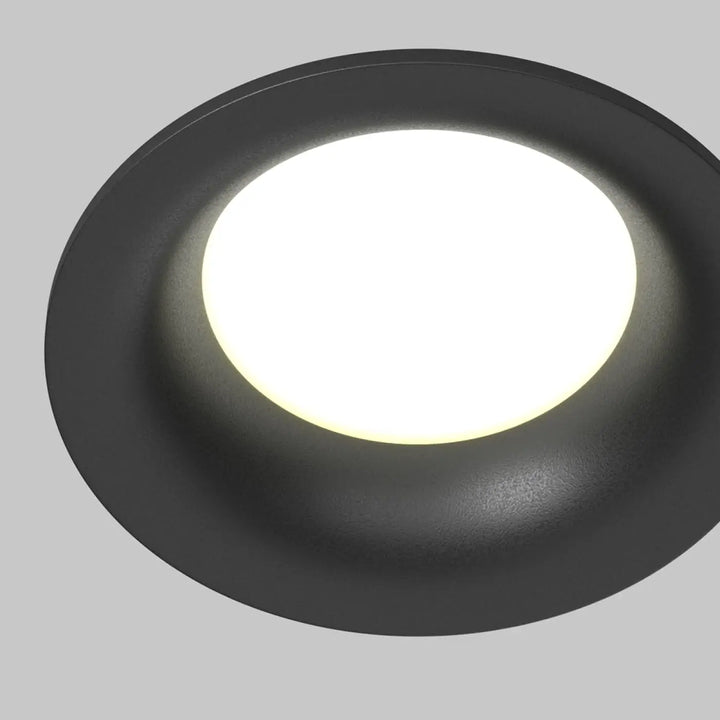 Spot encastré rond discret avec finition mate noire et panneau central blanc pour éclairage général uniforme