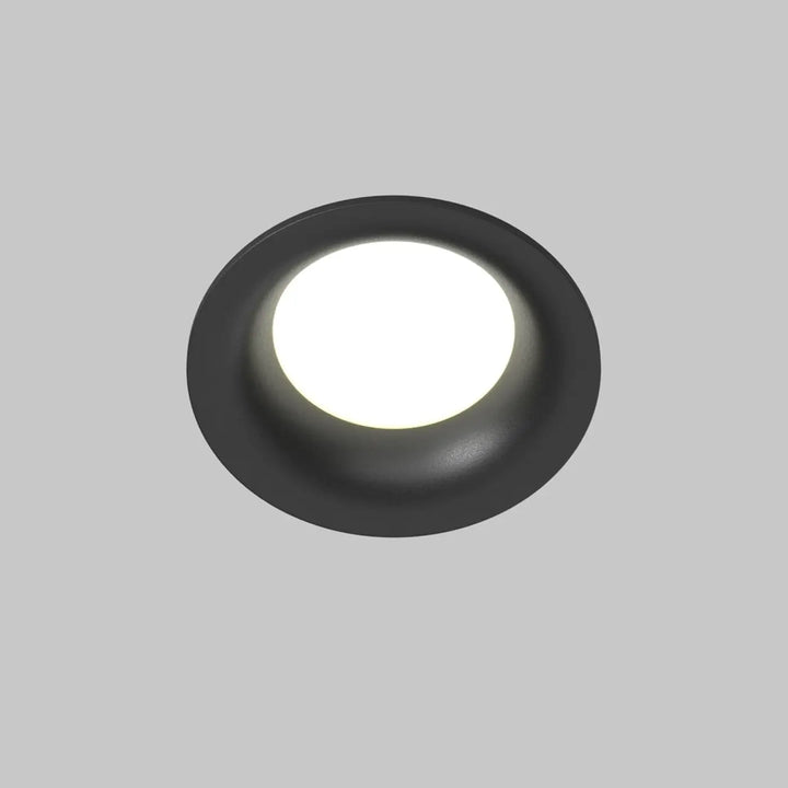 Spot encastré rond discret noir mat avec centre lumineux blanc pour éclairage général intérieur
