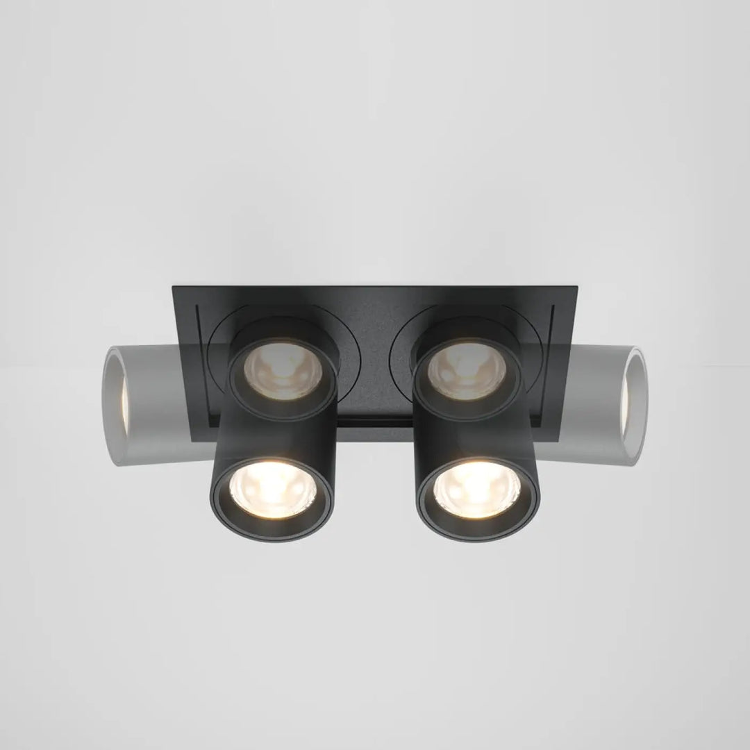 Spot hidden led rétractable en acier noir avec deux spots ajustables et extensions cylindriques grises au plafond