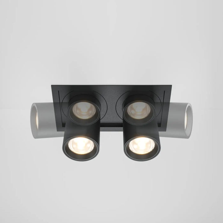 Spot hidden led rétractable en acier noir avec deux spots ajustables et extensions cylindriques grises au plafond