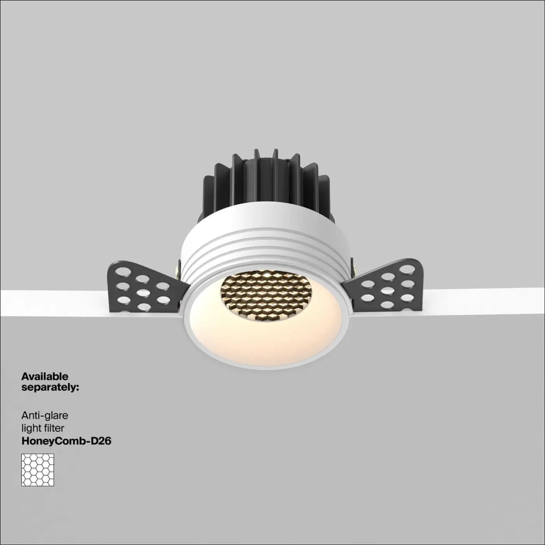 Spot led encastré blanc chaud round compact avec dissipateurs thermiques noirs et fixations perforées vue arrière