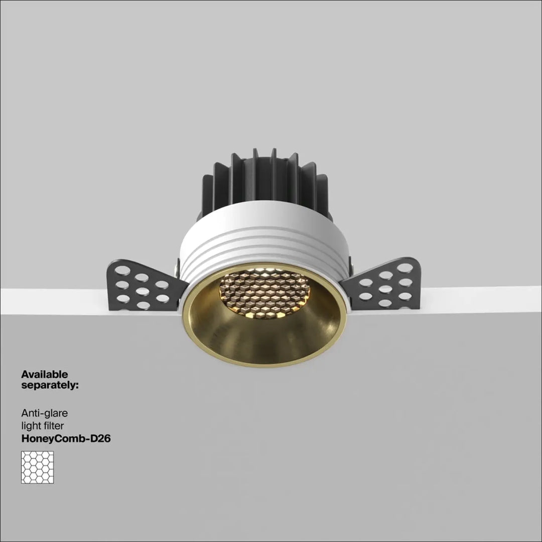 Spot led encastré round compact avec logement blanc nervuré, dissipateurs thermiques noirs et réflecteur intérieur doré blanc chaud
