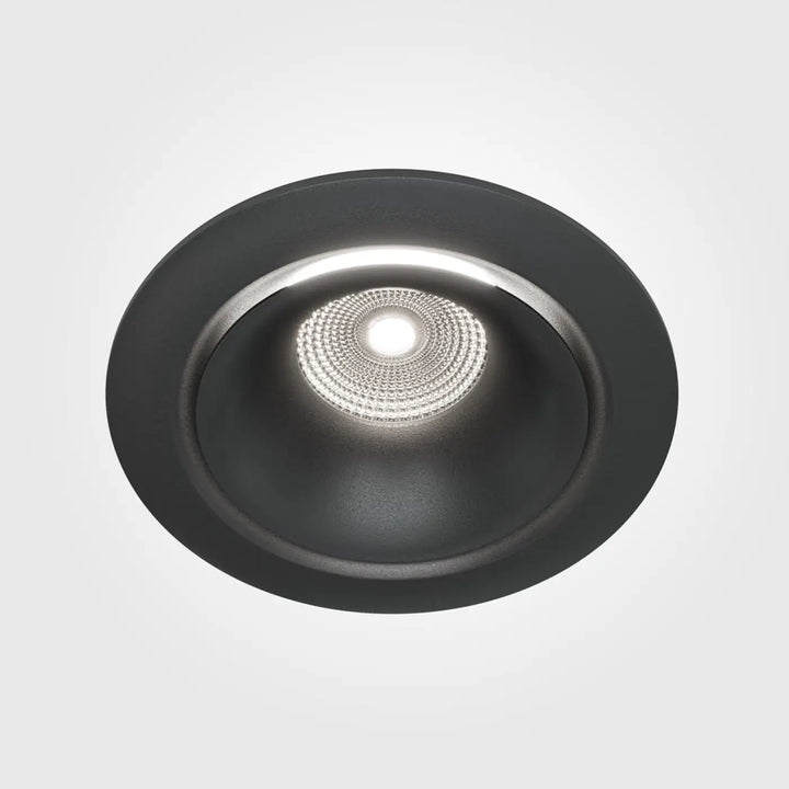 Spot yin led intégrée en finition mate noire avec leds blanc chaud disposées en cercle central